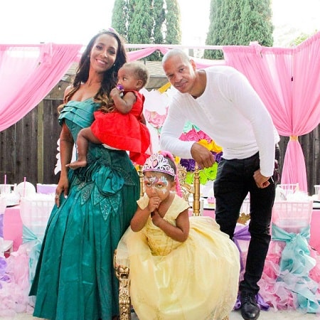 A picture of Amina Buddafly with her ex-husband, Peter Gunz and their daughters.